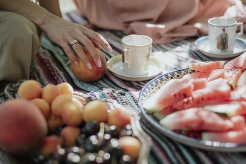 Wedding picnic with teacups and fruit